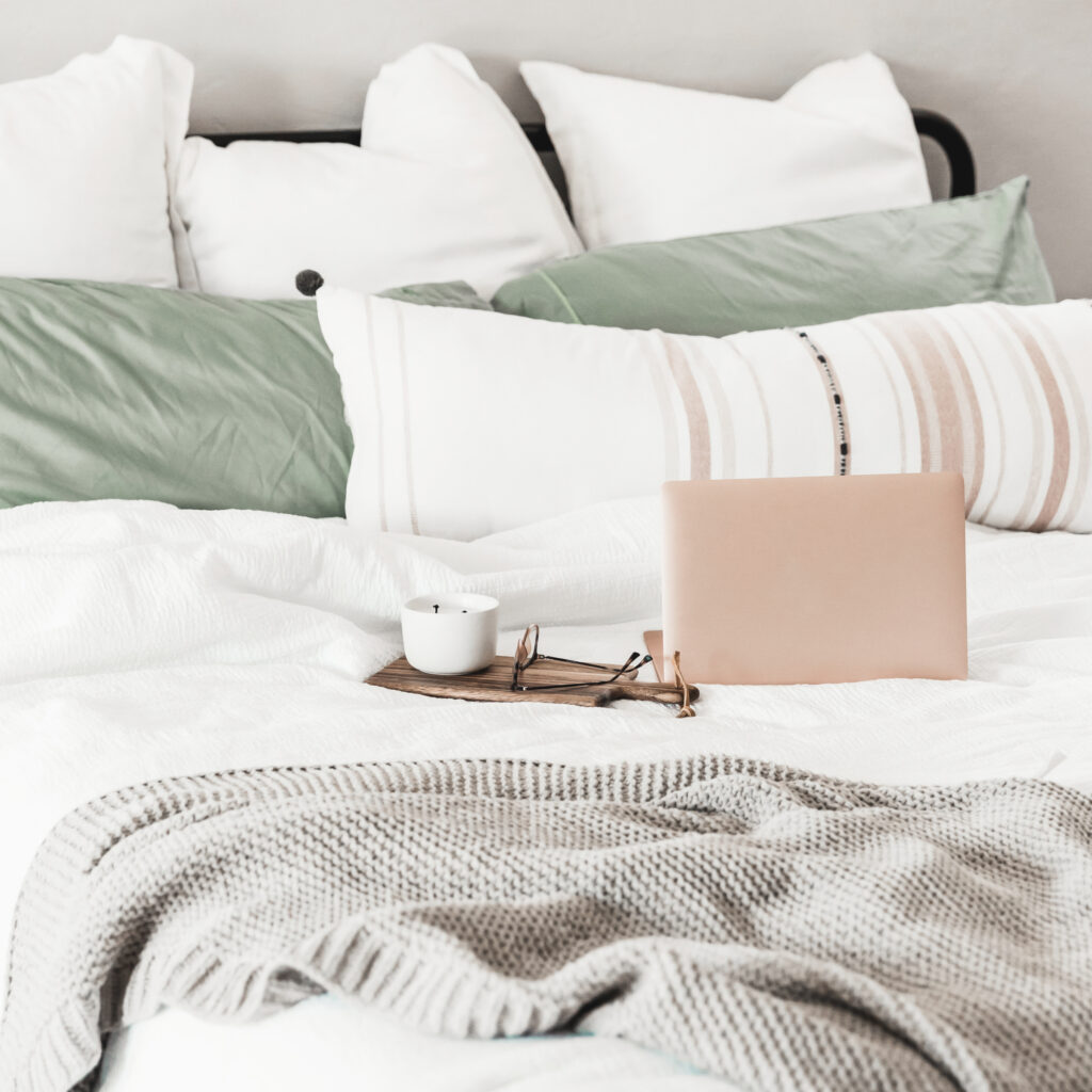 laptop computer sitting on bed