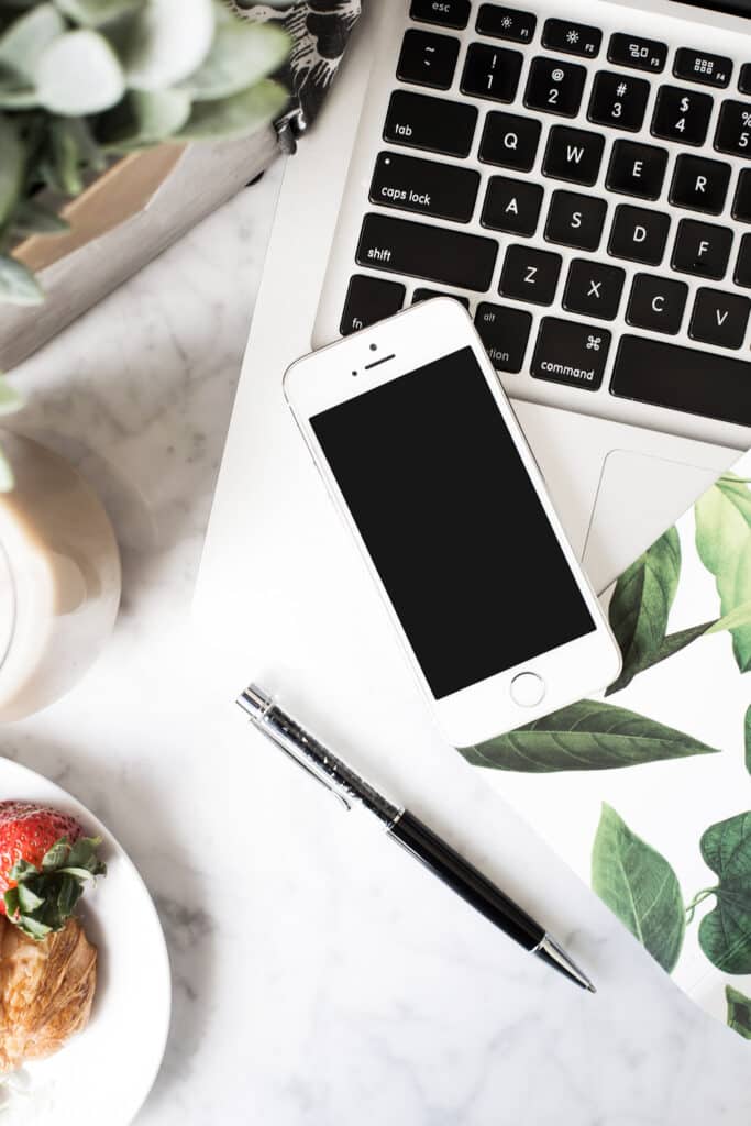 laptop and phone to research how to blog legally