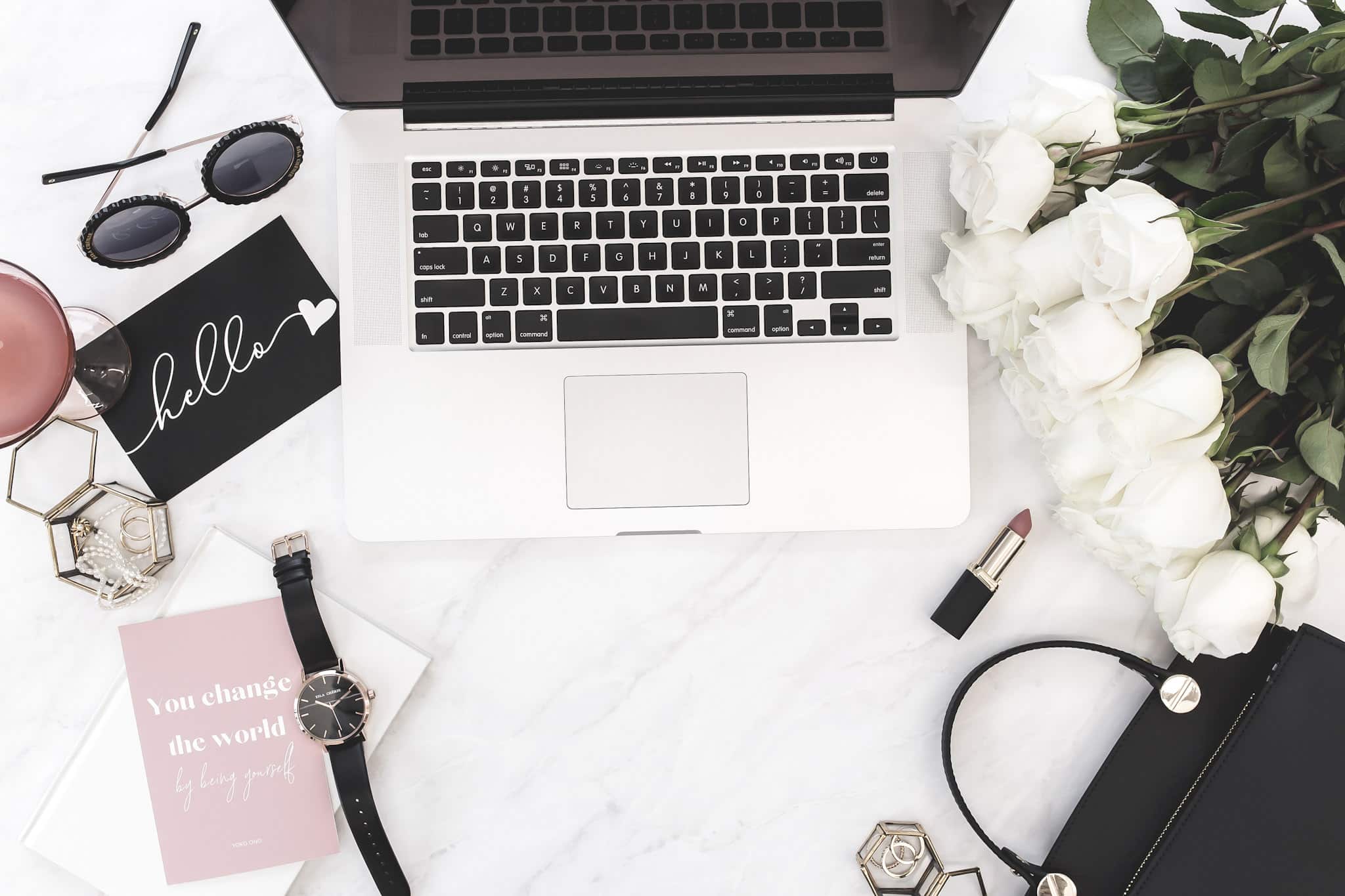 laptop on desk to research how to blog legally